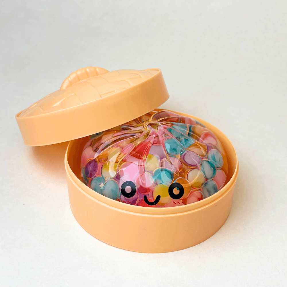 Mystery Color Dumpling Toy - Acrylic Hard Shell, Non-Squeezabl packaging